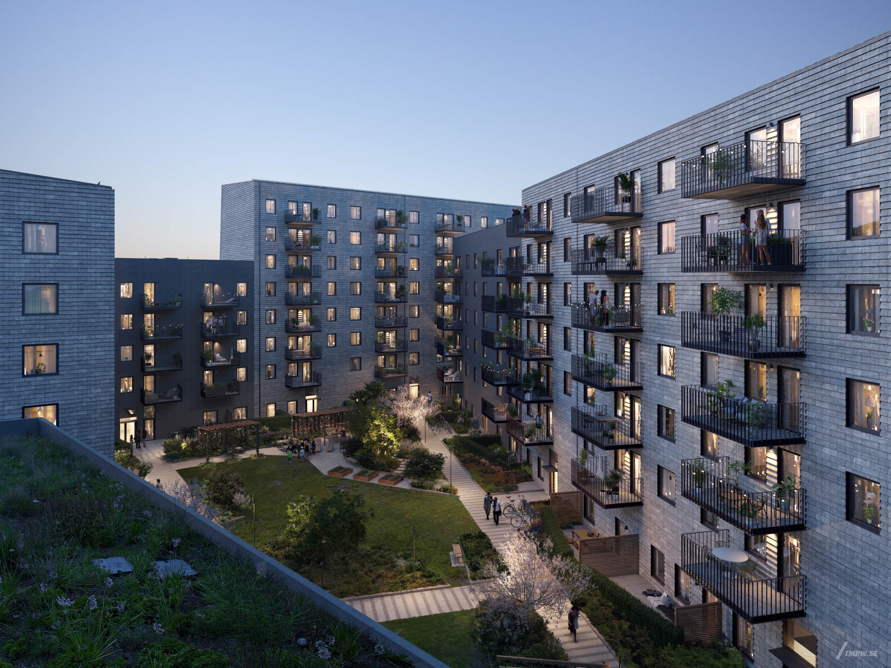 Architectural visualization of Lindholmshamnen for Riksbyggen a apartment complex in evening light from a semi aerial view.